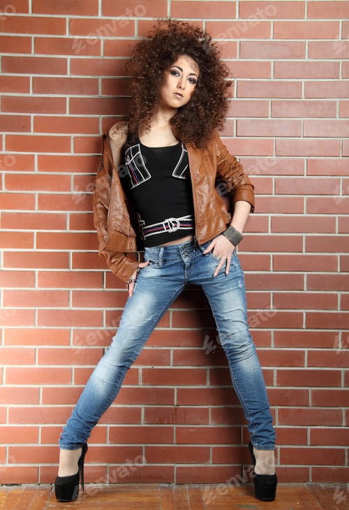 Preview: Beautiful Girl On A Background A Brick Wall