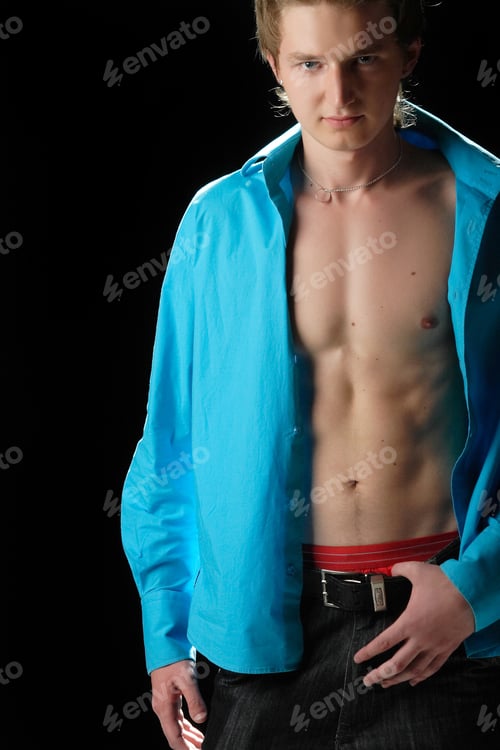 Preview: A Man With A Muscular Body In A Blue Shirt