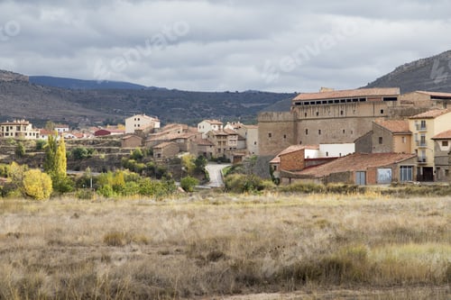 Preview: Autumn Landscape With Yellow Leaves Gudar Mountains Teruel Aragon Spain. Mora De Rubielos Village.