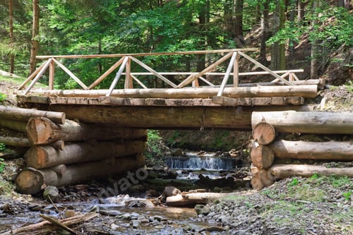Preview: A Wooden Bridge Through Mountain Stream In Forest