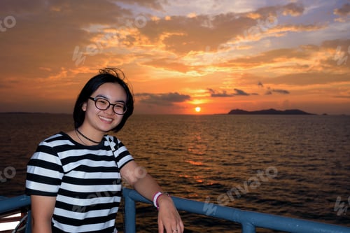 Preview: Beautiful Nature Of Colorful Sky And Sun At Sunset Over The Sea, Women Tourist On The Deck Of A