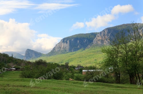 Preview: Spring Mountain Massif Landscape And Village In Foreground (Rock "Sokolinuj Vzljot" (Falcon Flying