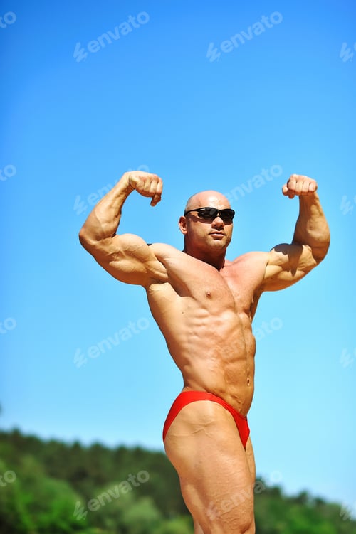 Preview: Bodybuilder Flexing His Muscles Outdoors