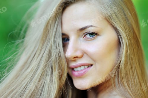 Preview: Portrait of Smiling Woman with Blonde Hair Outside