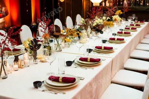 Preview: Decorated Table For A Big Celebration In The Evening In A Restaurant Decorated With Flowers And