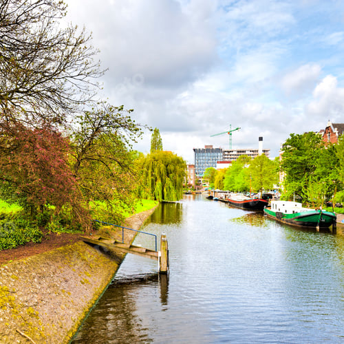 Preview: Urban Scene In Amsterdam With Typical Local Architecture. Embankment In The Historical Center Of