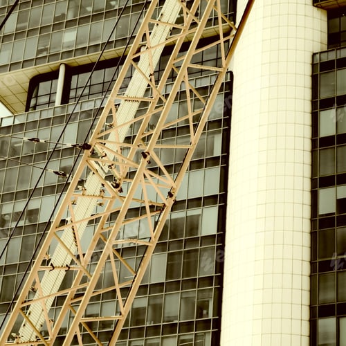 Preview: Crane And Building Under Construction In Tel-Aviv. Industrial Construction Crane In Israel. Vintage