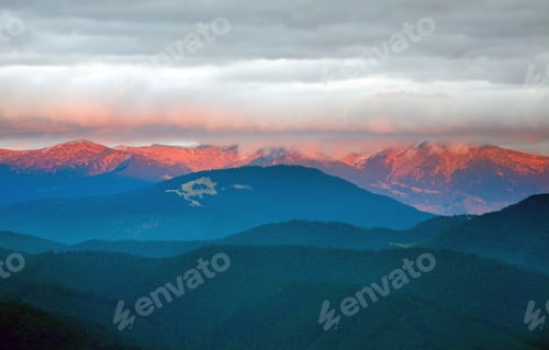 Preview: Autumn Evening Landscape With Lust Golden-Pink Sunlight On Mountains And Evening Glow In Sky
