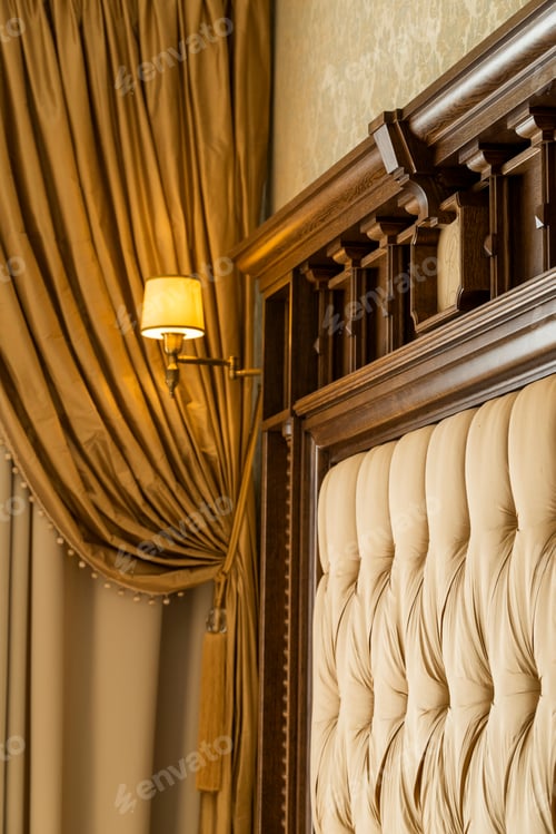 Preview: Included Wall Sconce Above The Headboard Of A Wooden Bed In The Interior