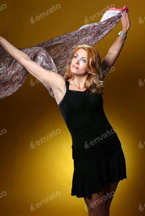 Preview: Elegant Woman Posing With Scarf on Yellow Background