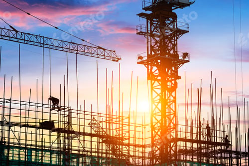 Preview: Construction Site With Crane And Workers At Sunset