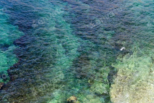 Preview: Limpid Sea Water Surface With Stones On Bottom. View From Above. Nature Background.
