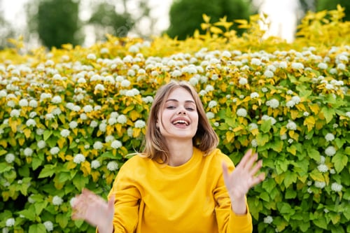 Preview: Joyful Woman In A Yellow Jacket In The Park Happy