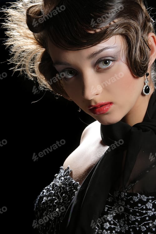 Preview: Portrait Of A Beautiful Brunette On Black Background