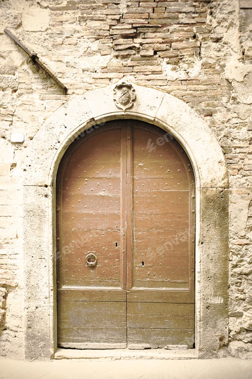 Preview: Traditional Old Vintage Wooden Door And Grunge Wall In Tuscany, Italy. Retro Style