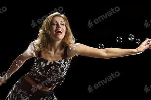 Preview: Beautiful Girl With Bubbles On Black Background