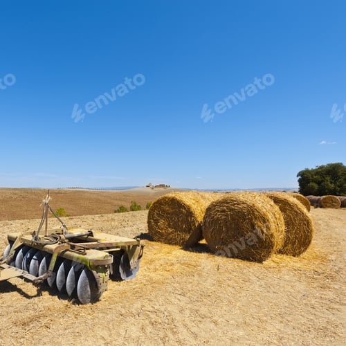 Preview: Landscape With Harrow On The Plowed Field In Italy. Hay Bales On The Plowed Hills Of Tuscany In The