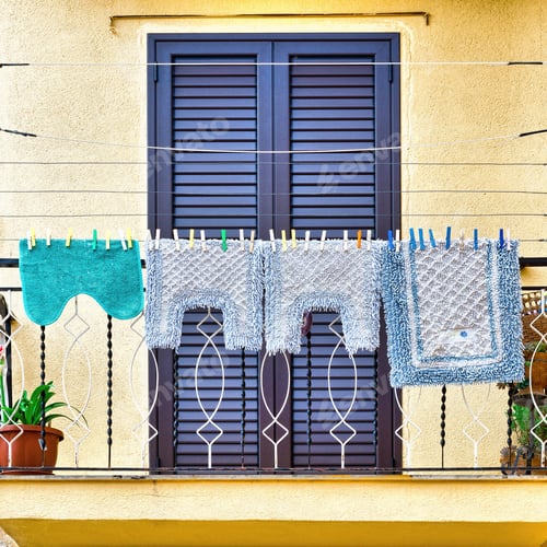 Preview: Italian Balcony In Palermo With Closed Wooden Shutters, Decorated With Mats