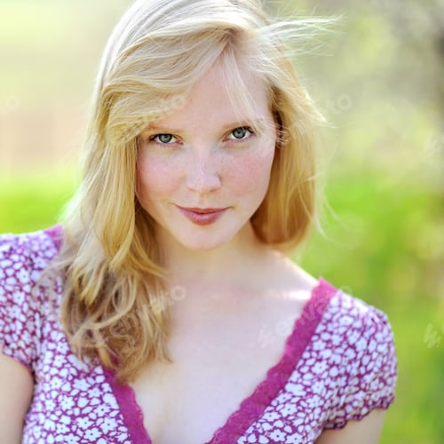 Preview: Attractive Young Woman Posing Outdoors in Floral Dress