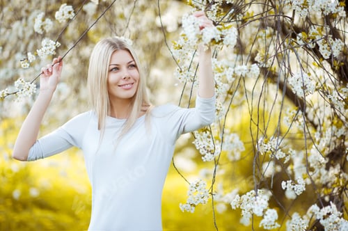 Preview: Woman In Blooming Tree In Spring