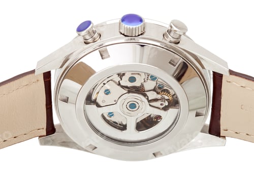 Preview: Wristwatch Internal Mechanism With Gears Behind The Glass Cover Of The Iron Case, Closeup.