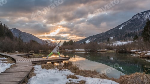 Preview: Young Woman During Her Morning Yoga Routine. Excercise In Nature At Sunrise.