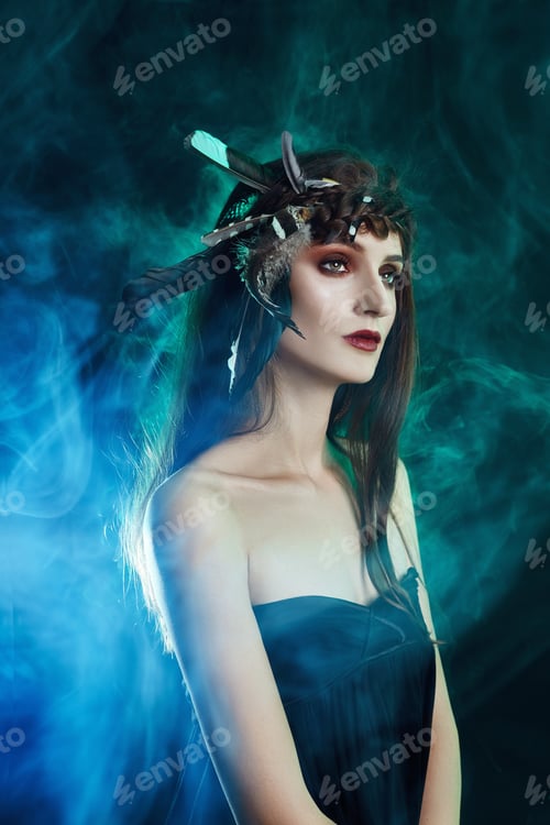 Preview: Indian Woman With Feathers In Her Hair, Portrait Of American Indian Girl Beauty On Dark Background