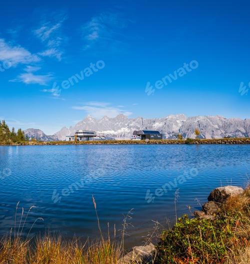Preview: Peaceful Autumn Alps Mountain Lake With Clear Transparent Water And Reflections And Upper Station