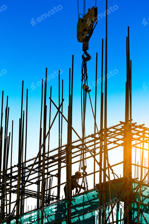 Preview: Construction Site With Crane And Workers At Sunset