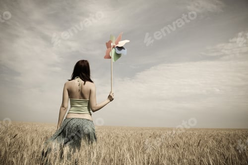 Preview: Girl With Toy Wind Turbine At Field, Photo In Age Style