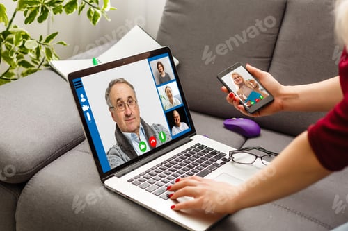 Preview: Cropped Image Of Young Woman Using Laptop For Video Conference At Home