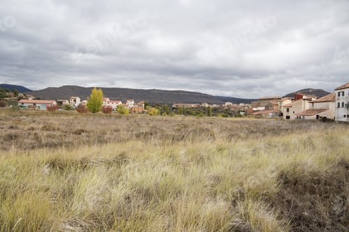 Preview: Autumn Landscape With Yellow Leaves Gudar Mountains Teruel Aragon Spain. Mora De Rubielos Village.