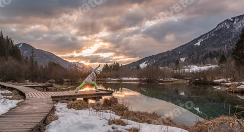 Preview: Young Woman During Her Morning Yoga Routine. Excercise In Nature At Sunrise.