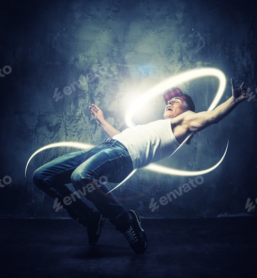 Preview: Stylish Man Dancer Showing Break-Dancing Moves With Magic Beams Around Him