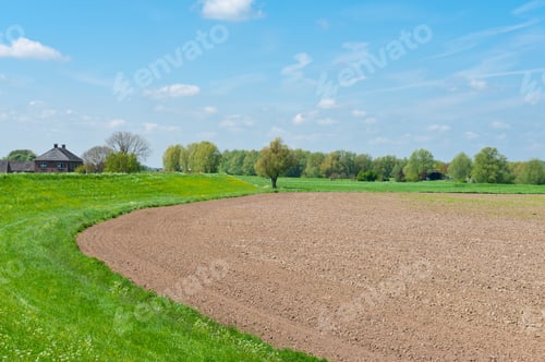 Preview: Protective Dam And Plowed Field In The Netherlands