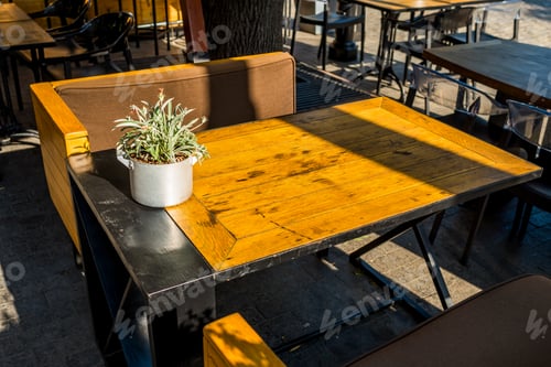 Preview: Wooden Table With Armchairs In A Cafe