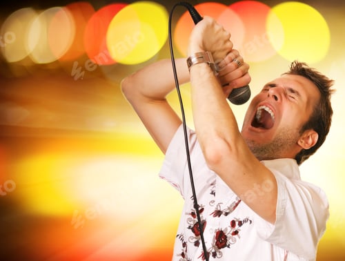 Preview: Young Guy With A Microphone Over Abstract Background