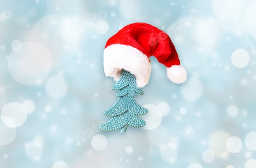 Preview: Christmas Tree In Santa Hat And Christmas Decoration Background.
