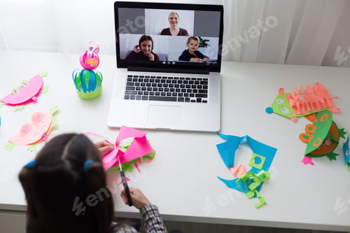 Preview: Beautiful Little Girl Cutting Paper With Scissors On The Art Lesson Class. Children Education