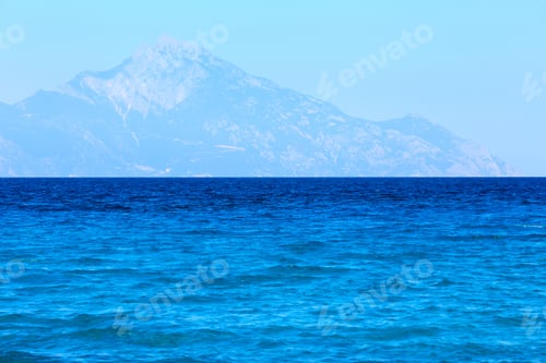 Preview: Aegean Sea Coast Landscape With Aquamarine Water And Mount Athos In Mist (Chalkidiki, Greece).