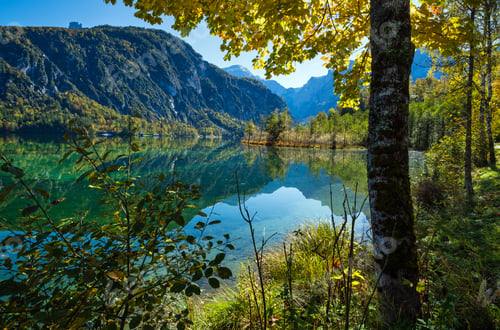 Preview: Sunny Idyllic Colorful Autumn Alpine View. Peaceful Mountain Lake With Clear Transparent Water And