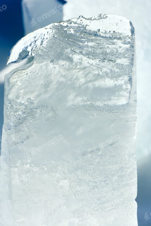 Preview: Melting Transparent Top Piece Of Ice Lit By The Spring Sunshine Closeup.