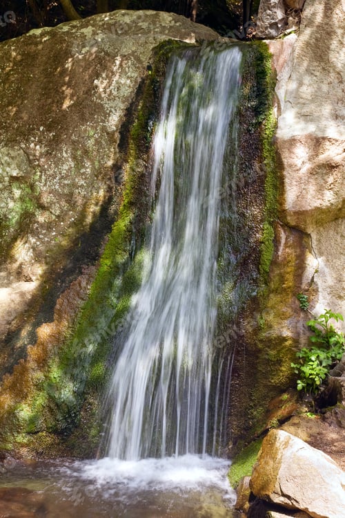 Preview: Small Spring Mountain Waterfall And Rock Behind