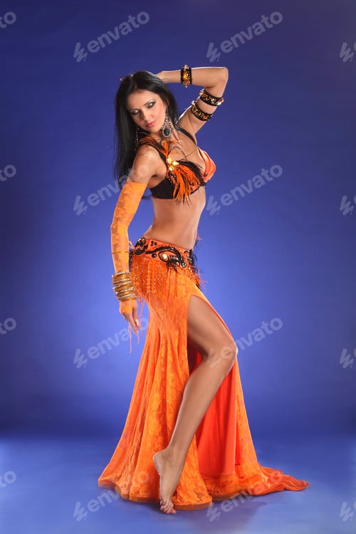 Preview: Beautiful Woman Dancing In Colorful Arabic Dance Costume.Girl In An Orange Dress. Beautiful