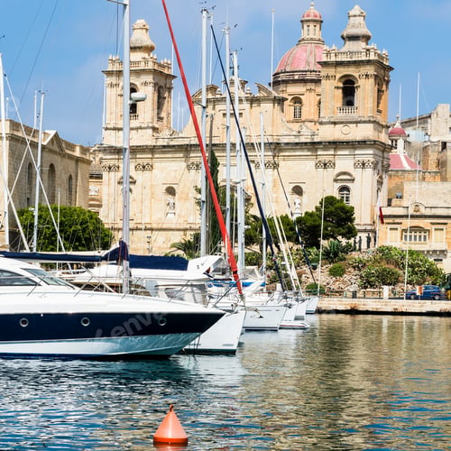 Preview: Yachts Docked At The Port Of Malta. Boats Moored In A Row On The Background Of Cathedral