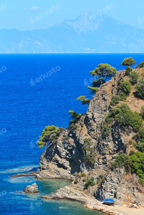 Preview: Aegean Sea Coast Landscape With Aquamarine Water And Mount Athos In Mist(Chalkidiki, Greece).
