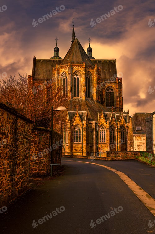 Preview: The Street Leading To The Church In Belgium. Cathedral Of St. Hubert In Belgium At Sunset