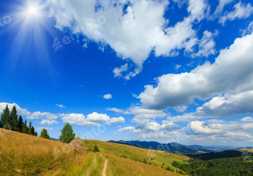Preview: Beautiful Blue Sunshine Sky With White Cumulus Clouds Over Summer Carpathian Mountain (Ukraine