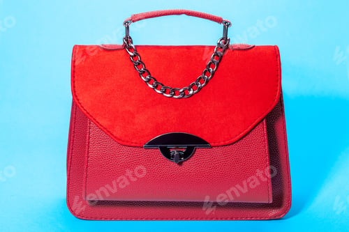 Preview: Women'S Handbag In Red Leather And Suede, Object On A Blue Background.