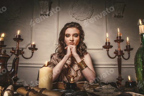 Preview: Woman Fortune-Teller Guesses Fate Of Night At Table With Candles. Halloween Magic Tale, Mysticism